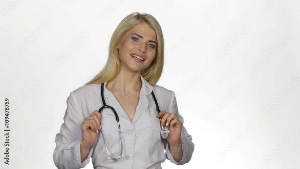 Medical female doctor looking to camera. White Medical female doctor looking to camera. White