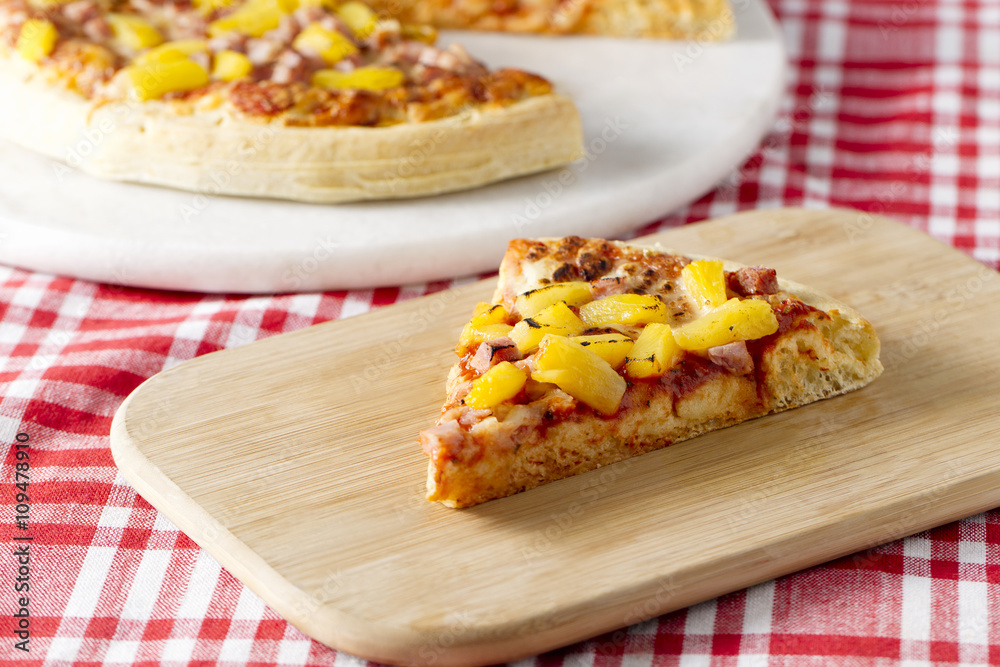 hawaiian pizza on a wooden plate hawaiian pizza on a wooden plate