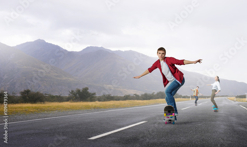 Young people riding skateboard © Sergey Nivens