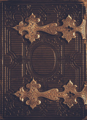 top view of antique book cover, with brass clasps