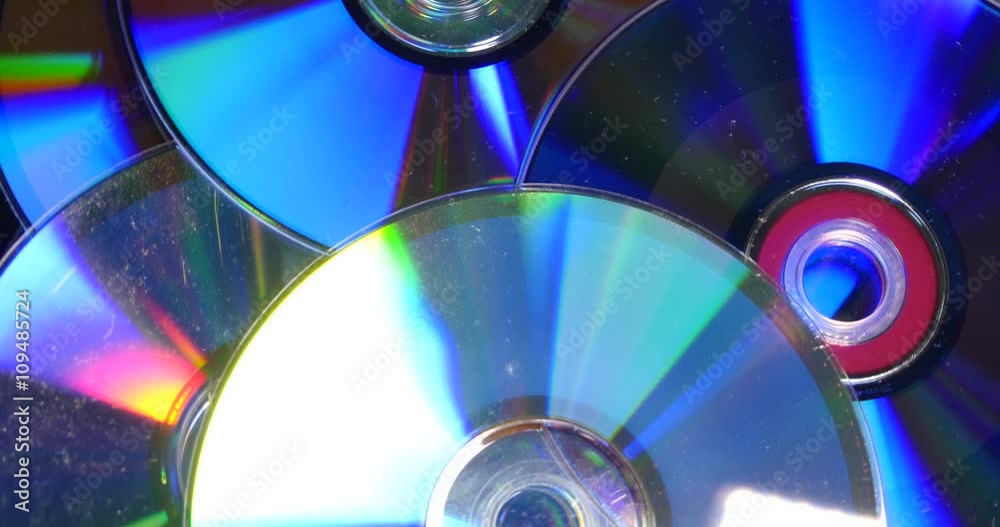Compact disks on a pile rotating, loop able Compact disks on a pile rotating, loop able