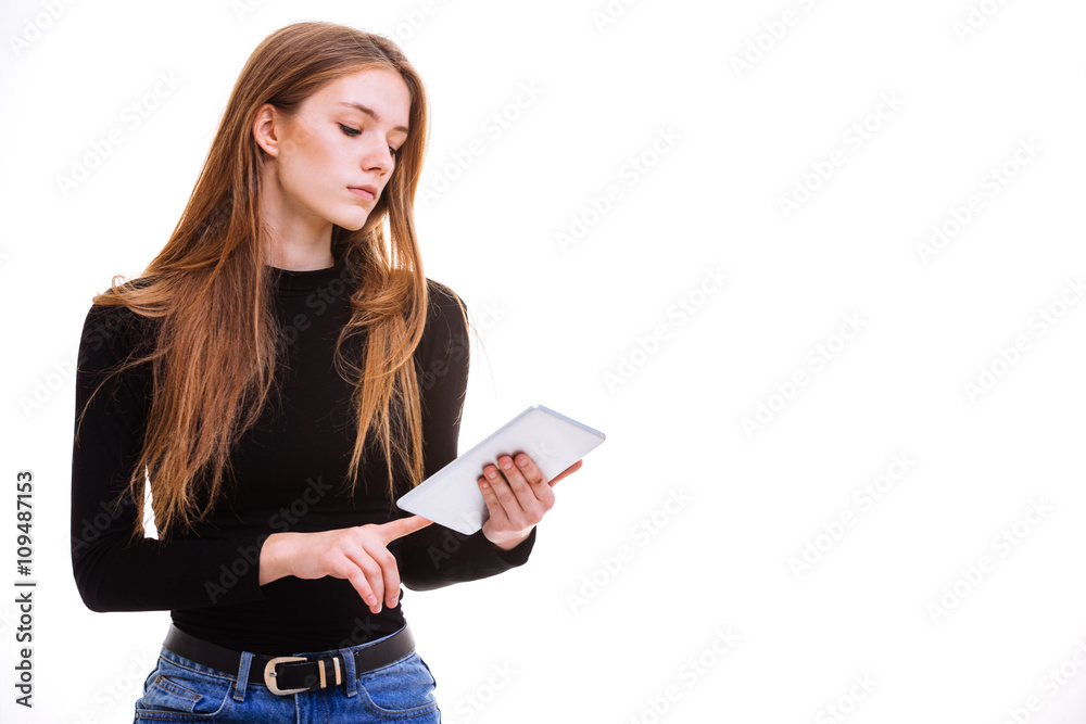 Beautiful young girl holding a tablet in the Studio. Beautiful young girl holding a tablet in the Studio.