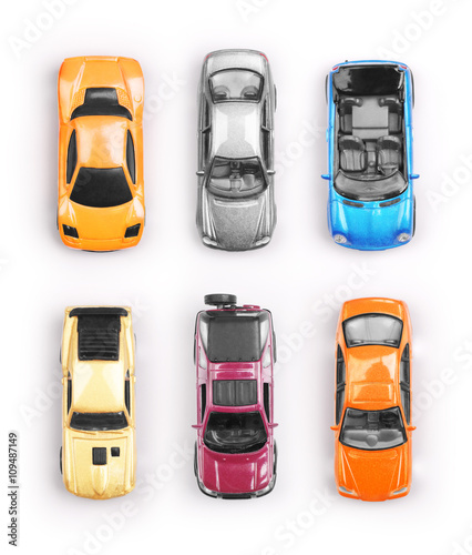 Many multi-colored toy cars on white background