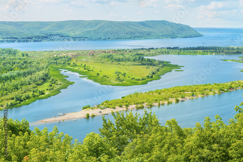 Scenic panoramic view from the height on the tourist part of the Volga river near Samara city at summer sunny day.Beautiful natural landscape.Russia. Europe.