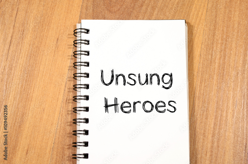 Unsung heroes write on notebook Unsung heroes write on notebook