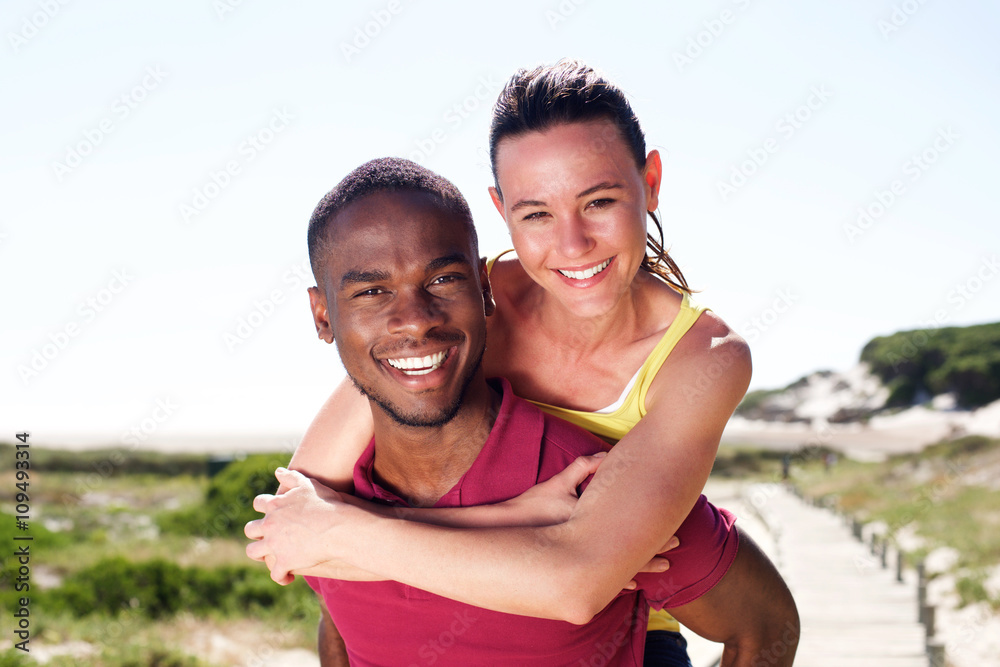 Cheerful young couple enjoying summer Cheerful young couple enjoying summer