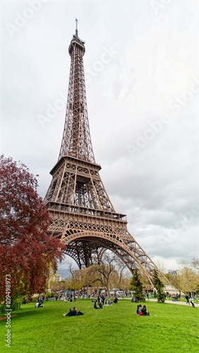 Close-up view on the Eiffel tower from field of Mars. Paris
