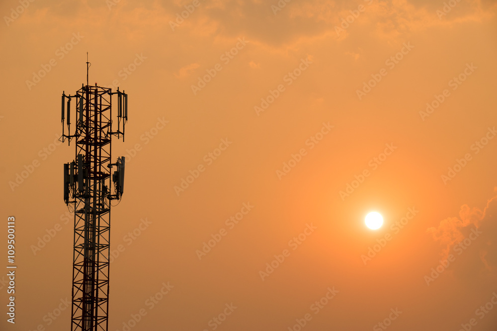 Cell Phone Antenna Tower on orange sky and sun