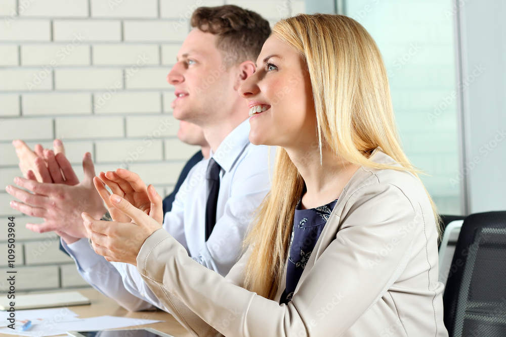 Close-up of business people clapping hands. Business seminar concept