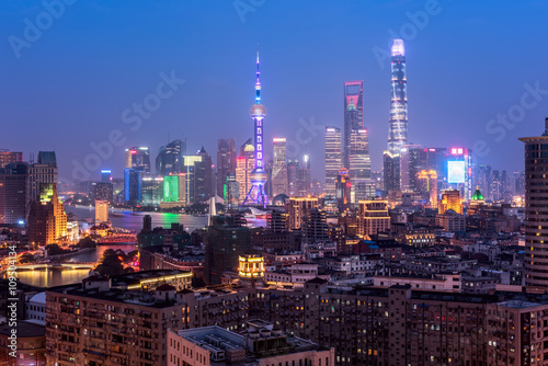 Elevated  view of Shanghai skyline at night. © fazon