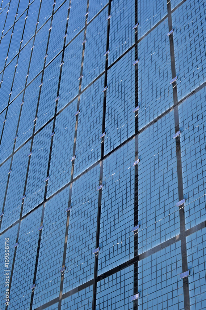 Detail of a structure of blue glass panels on the facade of a building Detail of a structure of blue glass panels on the facade of a building