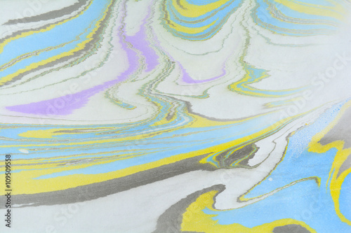 Ebru art. Traditional Turkish Ebru technique. Marbling painting on water transferred on highly textured paper or cloth. Color paint ebru with waves and tile pattern.
