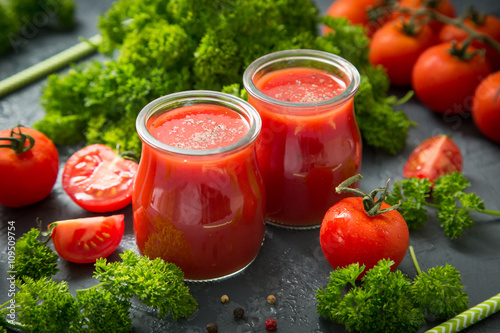 fresh organic tomatoes and tomato juice with parsley. the detox