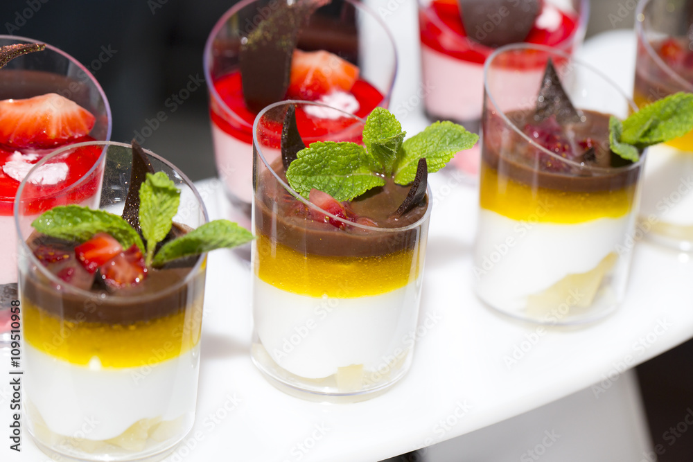 mini canapes in plastic cups decorated with edible flowers mini canapes in plastic cups decorated with edible flowers