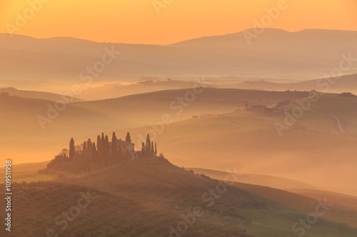 Misty sunrise in the Val d   Orcia  or Valdorcia  a region of Tuscany  central Italy  which extends from the hills south of Siena to Monte Amiata. 