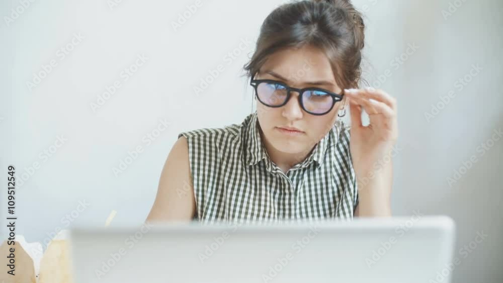 Young beautiful girl with a laptop at home Young beautiful girl with a laptop at home