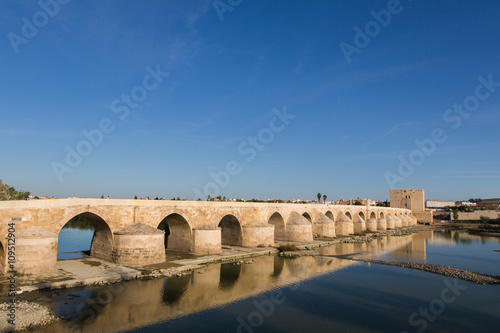 Roman bridge across the Guadalquivir river, built in the early 1st century BC in the Historic center of Cordoba, Andalusia, South of Spain   © aleksred