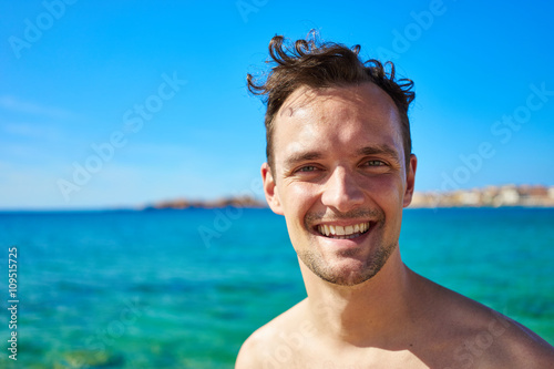 Guy in the sun on beach / enjoying vacation at beach / relaxed guy © marako85