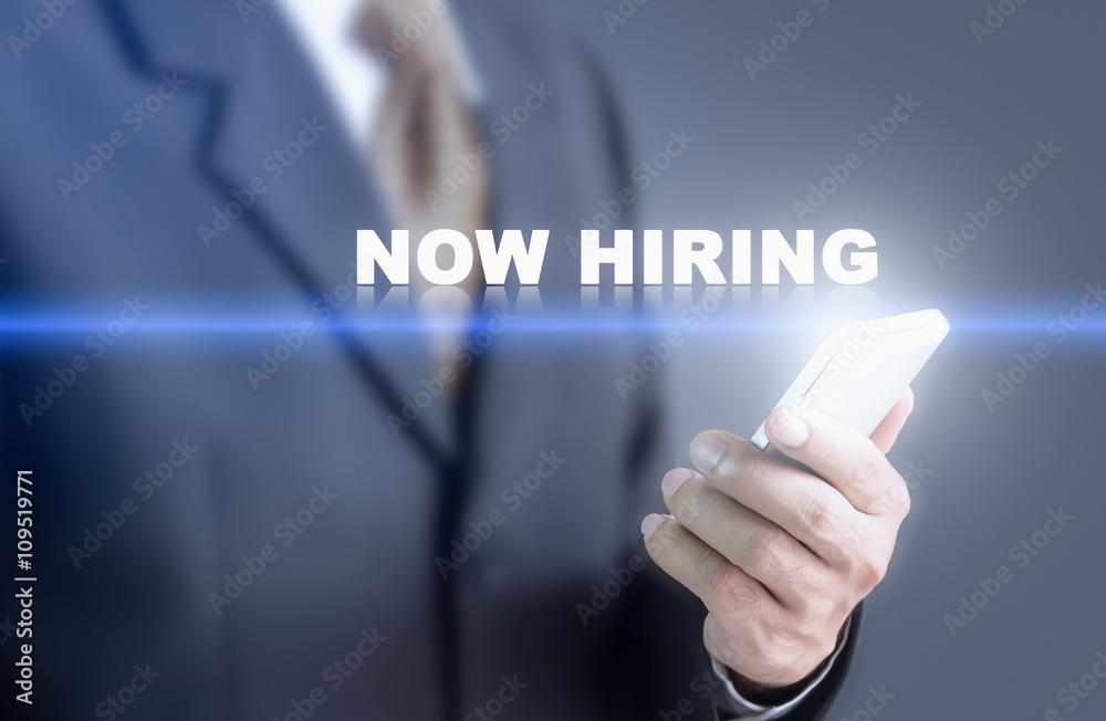 Businessman pressing hand NOW HIRING message on virtual screen. Can bring to the medium of your ad. Businessman pressing hand NOW HIRING message on virtual screen. Can bring to the medium of your ad.