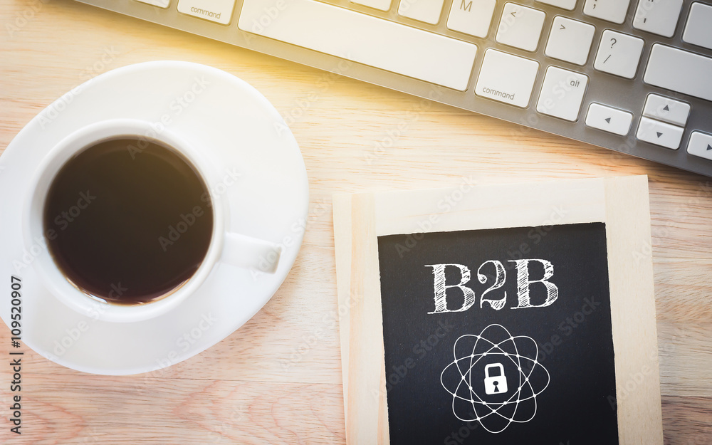 Concept B2B message on wood boards. A keyboard and a glass coffee table.Vintage tone. Concept B2B message on wood boards. A keyboard and a glass coffee table.Vintage tone.