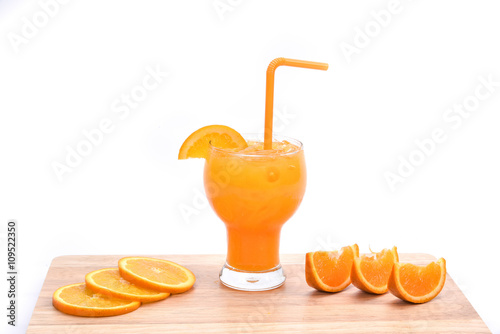 Orange juice smoothie and slices of orange on white background