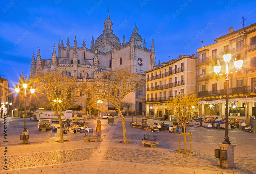 SEGOVIA, SPAIN, APRIL - 15, 2016: The Plaza Mayor square and the morning market and the Cathedral at dusk.