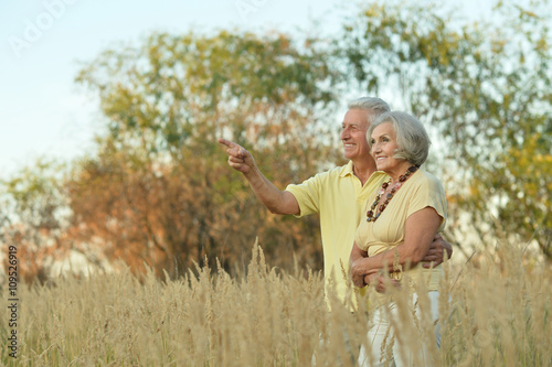 happy senior couple in summer