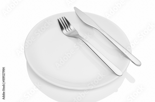 Dining etiquette - the meal is over. Fork and knife signals with location of cutlery set. Photo illustration isolated on white background.