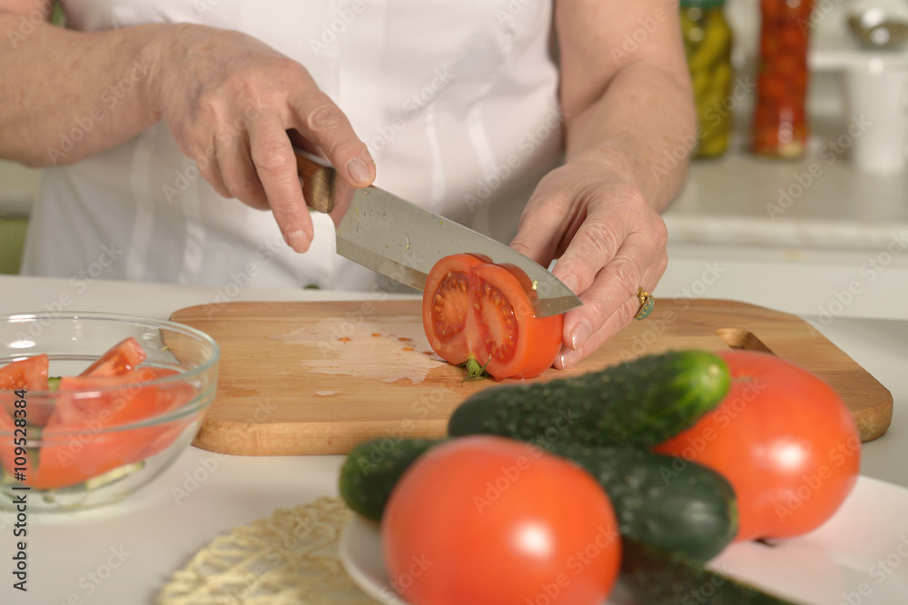 Senior woman cooking in kitchen