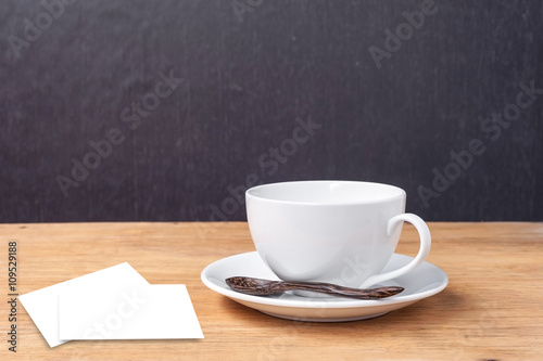 Cup of coffee with business card