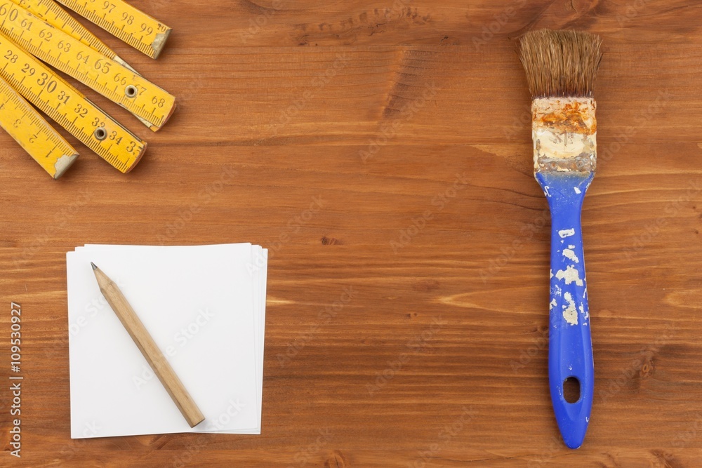 Paint brush on wooden background. Sales of paints and brushes. Housework. Supplies for painters.
