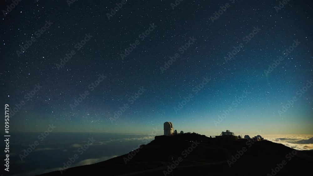 Star time lapse, milky way galaxy moving across the night sky above observatory