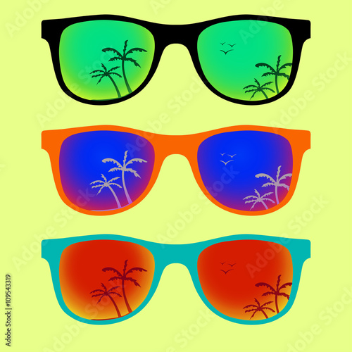 Trendy sunglasses with colorful lens and frame reflect summer palms