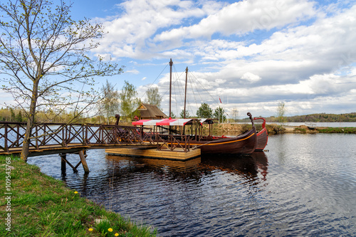 Latvian wooden sailing boats near small pier at Liepkalni town, Latvia