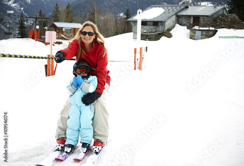 Male toddler in front of mother moving up on ski rope, Les Arcs,Villaroger,Savoie,France