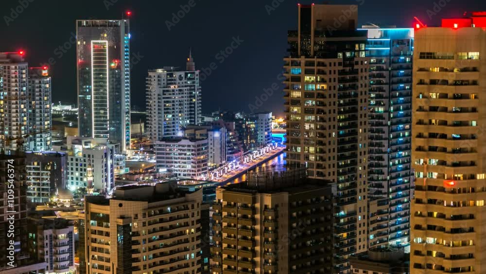 Beautiful aerial top view at night timelapse of Dubai Marina in Dubai, UAE