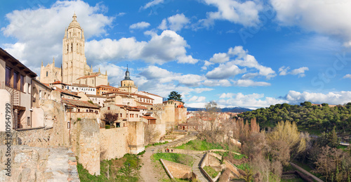 Segovia - Cathedral Nuestra Senora de la Asuncion y de San Frutos de Segovia and the wall of town in evening light.