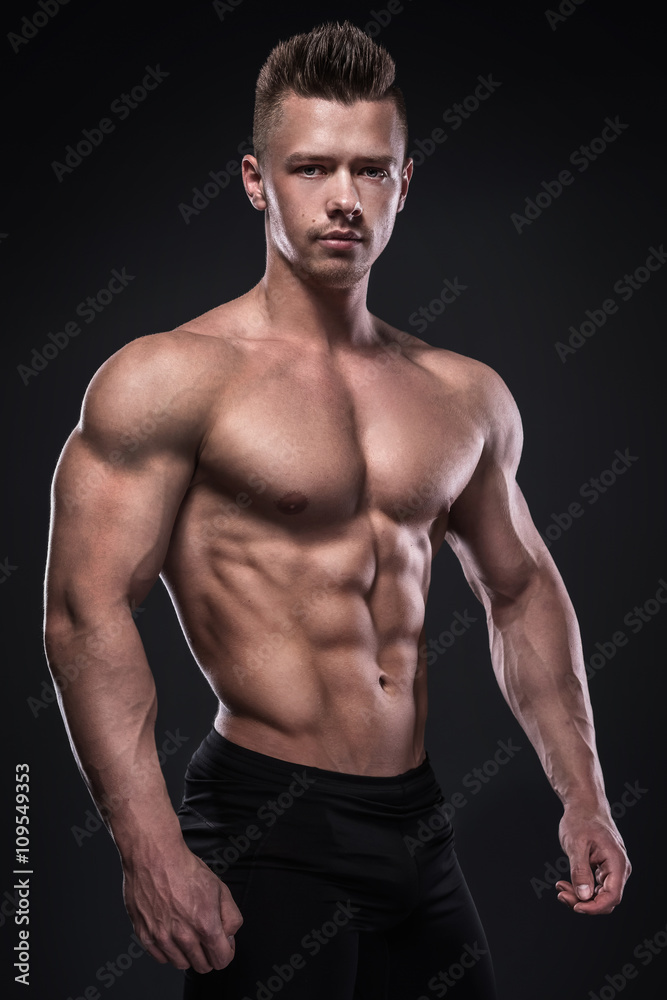 Young bodybuilder showing his muscles