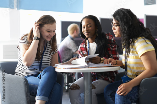 Teenage girls working together in class photo