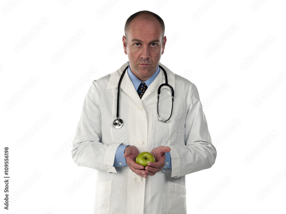 portrait view of a doctor holding an apple. portrait view of a doctor holding an apple.