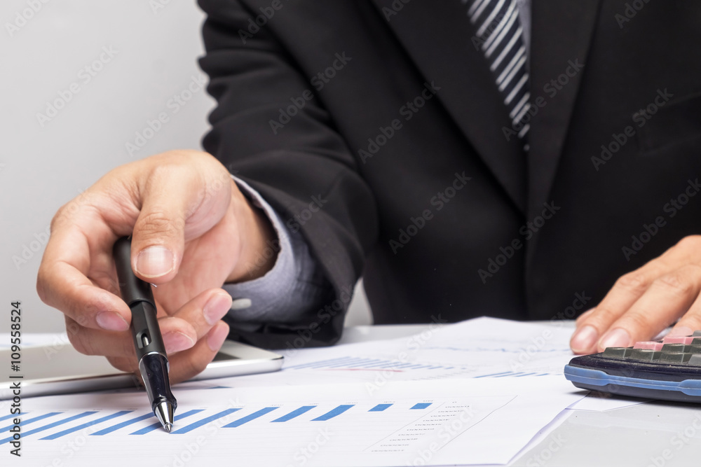 Business people discussing financial charts - closeup shot of ha Business people discussing financial charts - closeup shot of ha