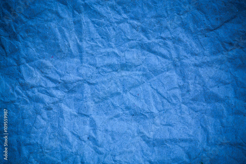 Blue crumpled eco paper background.