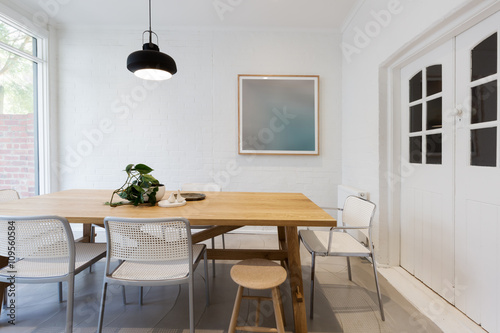 Modern scandinavian styled interior dining room with pendant lig