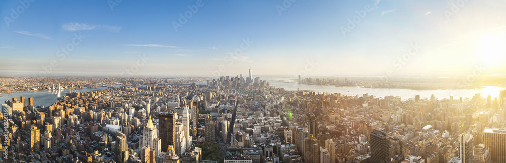 Vast panoramic cityscape with skyscrapers and distant rivers, New York, USA Vast panoramic cityscape with skyscrapers and distant rivers, New York, USA