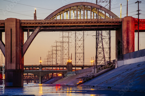 Los Angeles river embankment and 6th and 7th street bridges in the evening, Los Angeles, California, USA photo