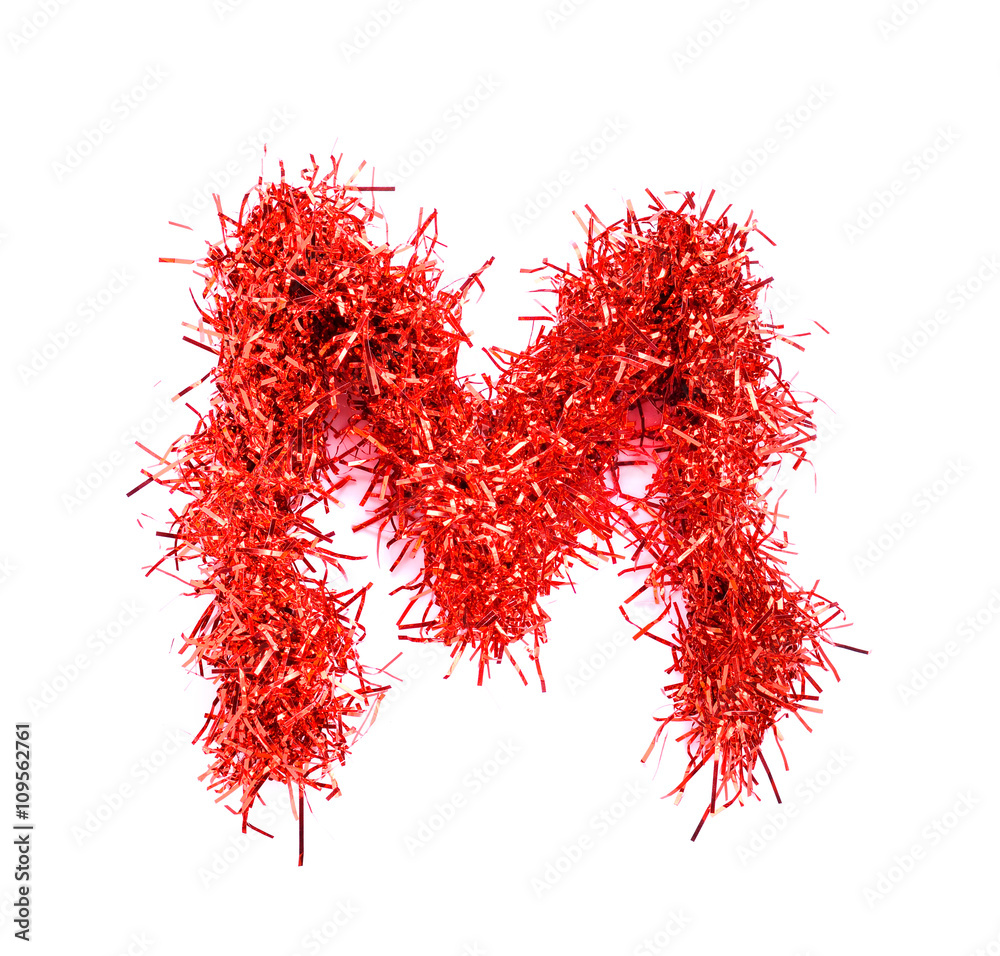 Naklejka premium Tinsel Christmas decoration in form of M. On a white background