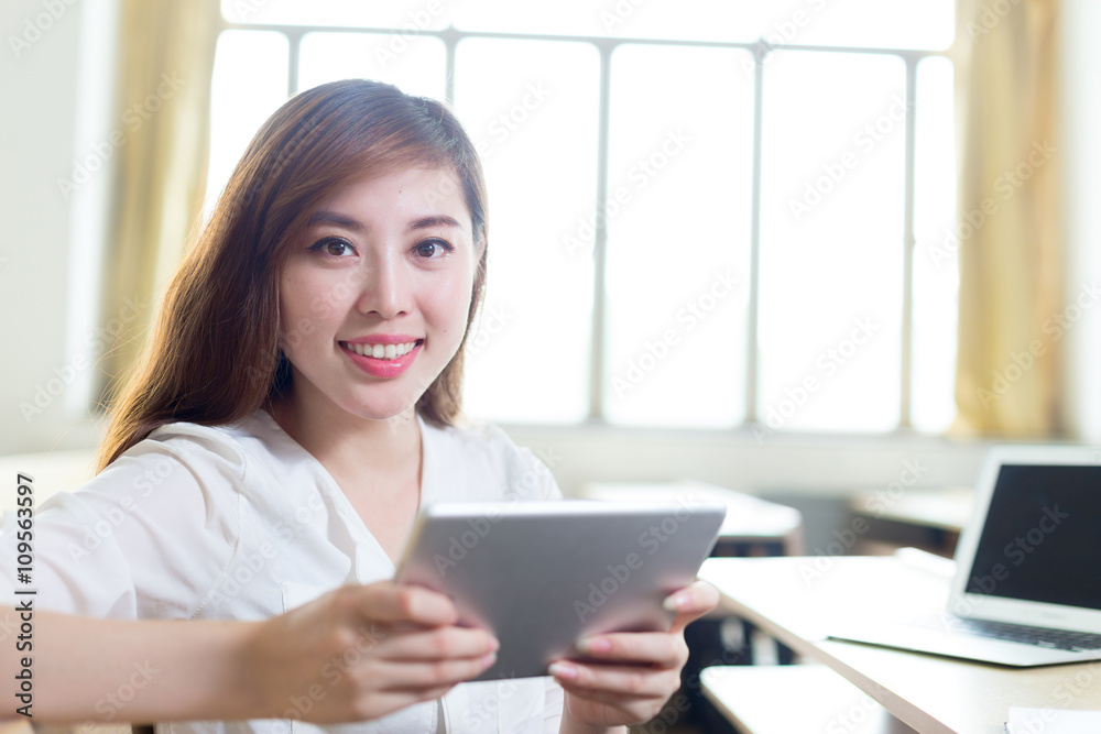 young beautiful asian girl student in classroom young beautiful asian girl student in classroom