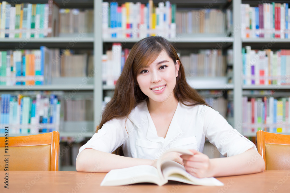 young beautiful asian girl in school library young beautiful asian girl in school library