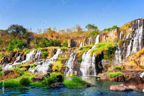Beautiful view of natural cascading waterfall in autumn