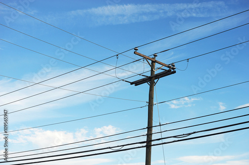Принти на полотні power pole under blue sky, vertical composition